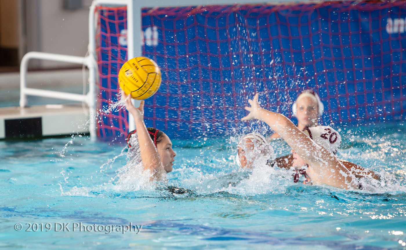 Diana Freeman (#4), City College freshman gets double teamed in the match against Sierra College at Hoos Pool on Oct. 9th. 