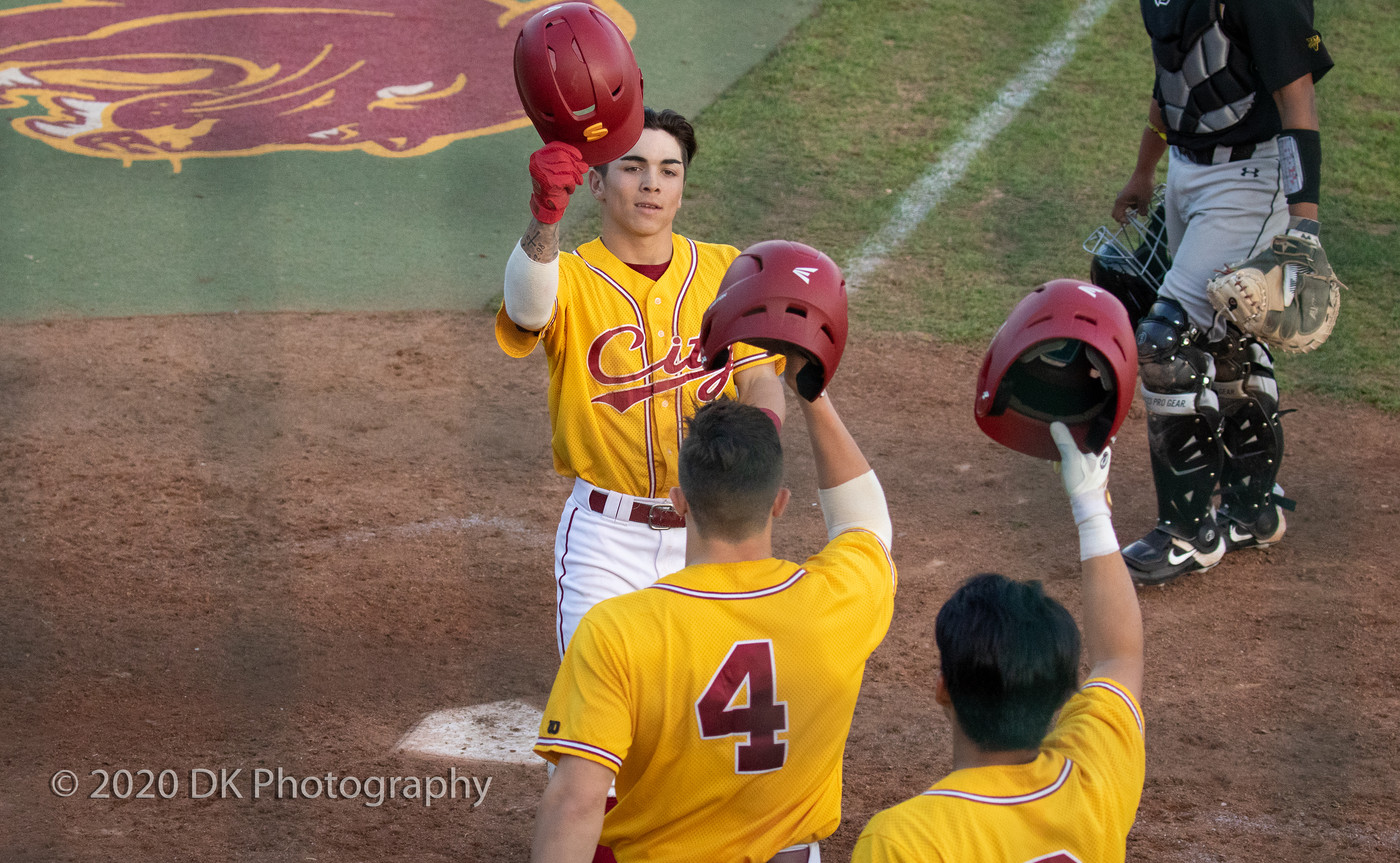 Dan Sayre (#3), City College sophomore is all smiles after hitting a 3 run homer in the first game of a double header against Chabot College at Union Stadium on Jan. 31st.