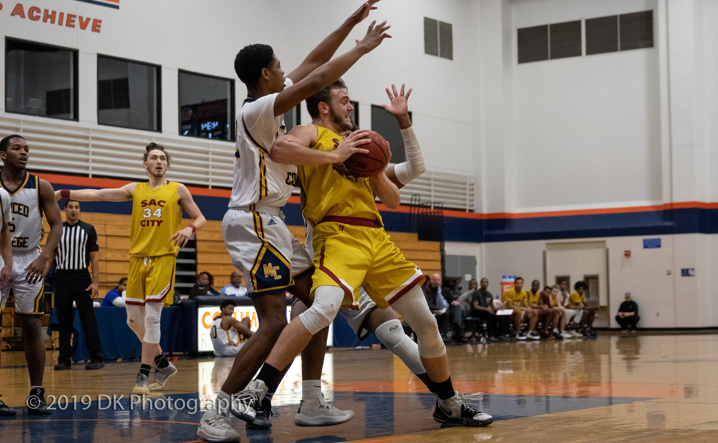 Terry Moody (#55), City College sophomore fights for position in the paint in the game against Merced College at the Cosumnes River Gym in the James Clark Classic on Dec. 5th.