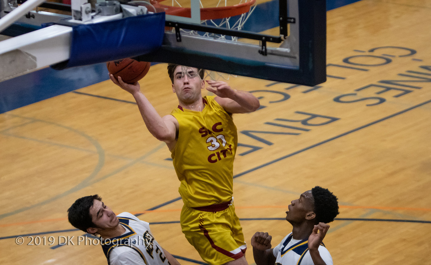 Conor Jeffery (#30), City College sophomore takes it to the hoop in the game against Merced College at the Cosumnes River Gym in the James Clark Classic on Dec. 5th.
