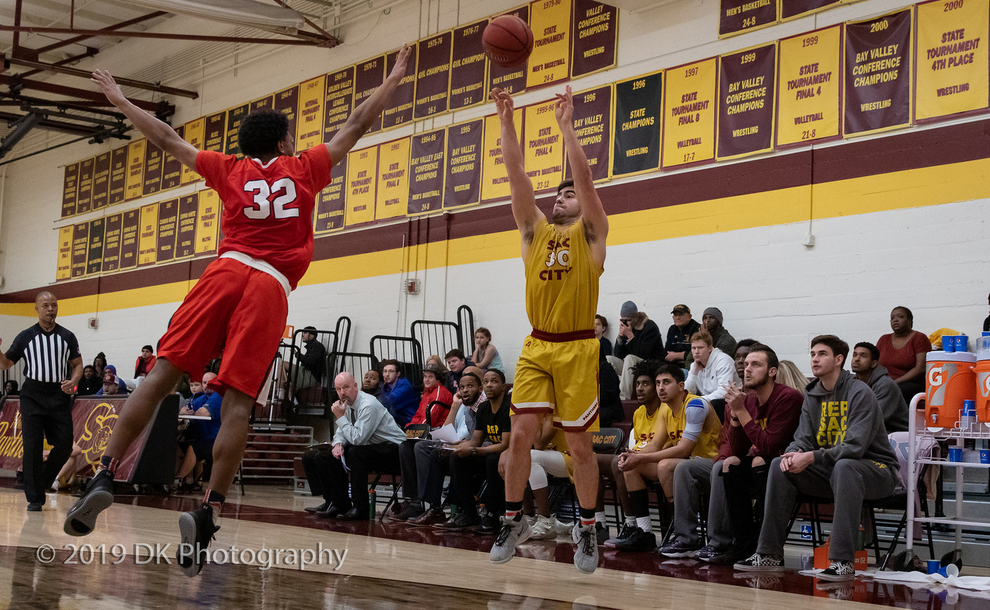 Conor Jeffery (#30), City College sophomore makes the three pointer in the game against American River College at the North Gym on Dec. 18, 2019 