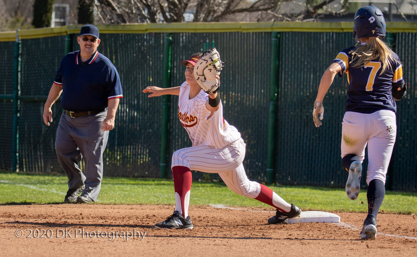Elisa Cueva (#21), City College freshman first baseman stretches out to make the catch in the first game of a double header against Merced College at The Yard on Feb. 11th. 
