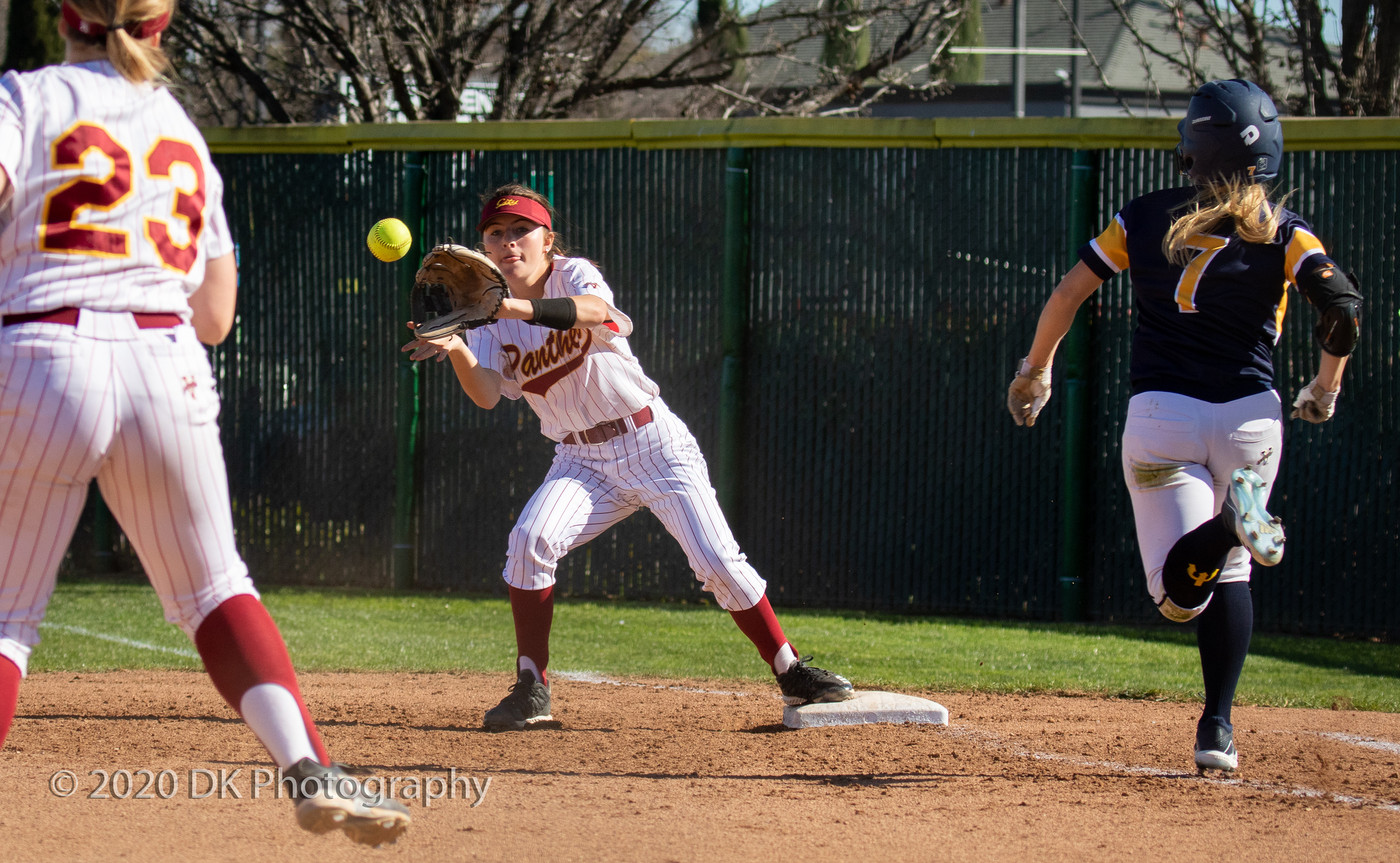 Patti Swimley (#6), City College sophomore covers first on a bunt and makes the catch for the out in the first game of a double header against Merced College at The Yard on Feb. 11th. 