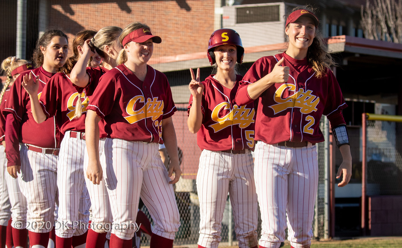 City College sophomores Rylee Retzer (#2) and Shelby Lloyd (#5) lead the way to high five Merced College after winning both games of the double header at The Yard on Feb. 11th