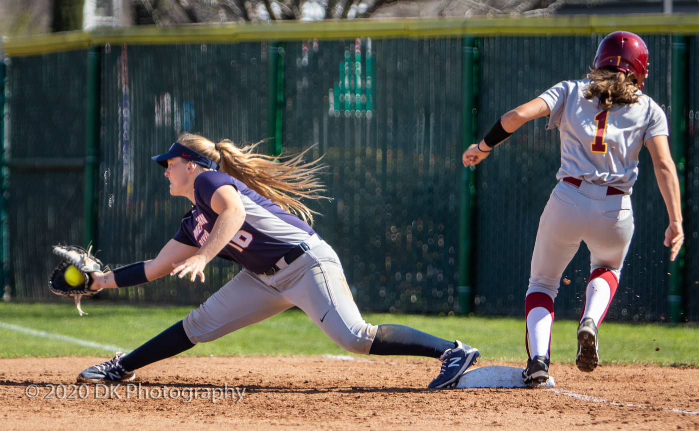 Deja Acosta, (#1), City College sophomore has a close call at first but is called out in the first game of a double header against American River College at the Yard on Feb. 22.