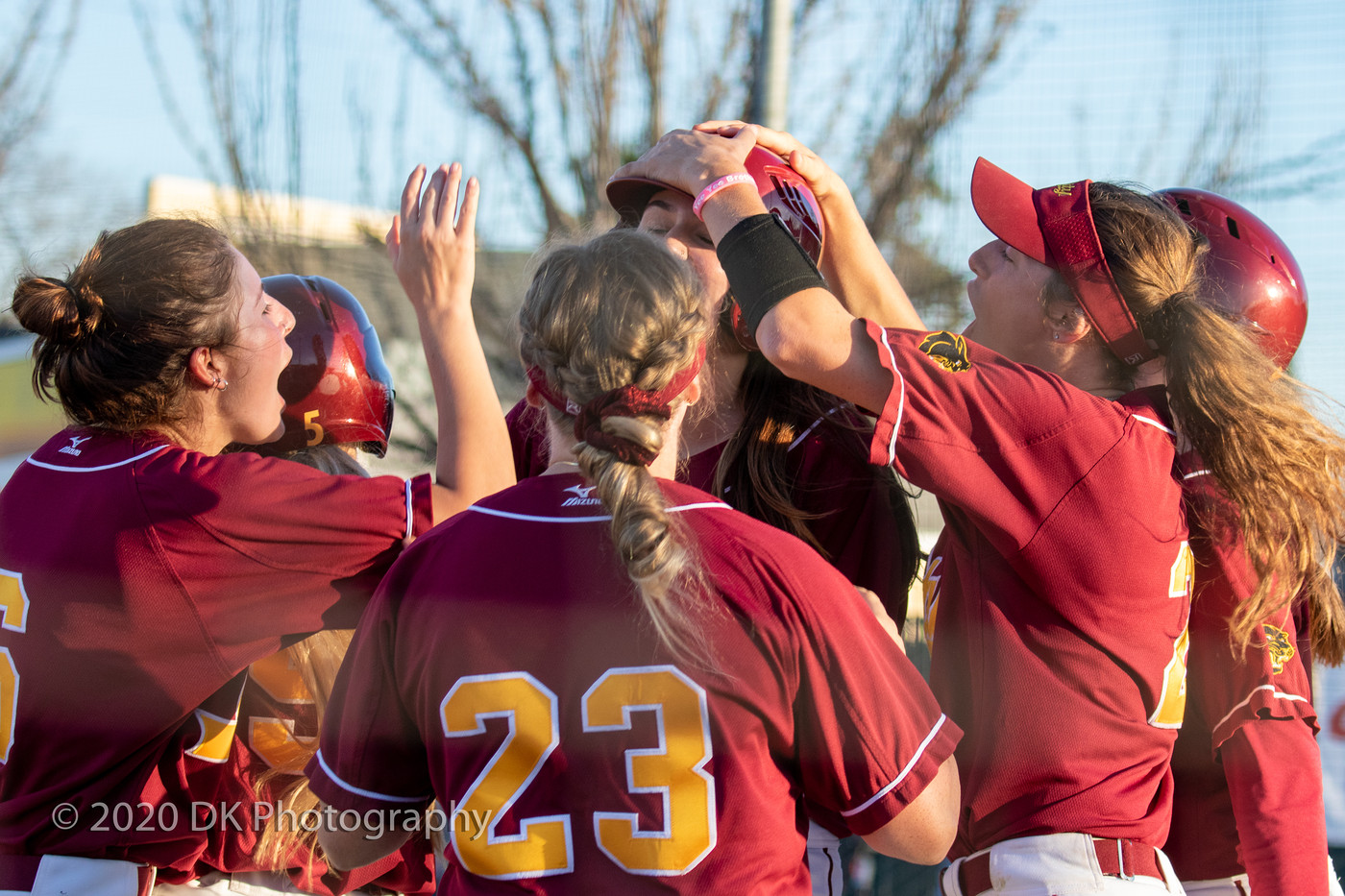 Elisa Cueva (center), City College freshman gets mobbed by teammates after hitting the walk off home run against Consumnes River College on Feb. 25th. 