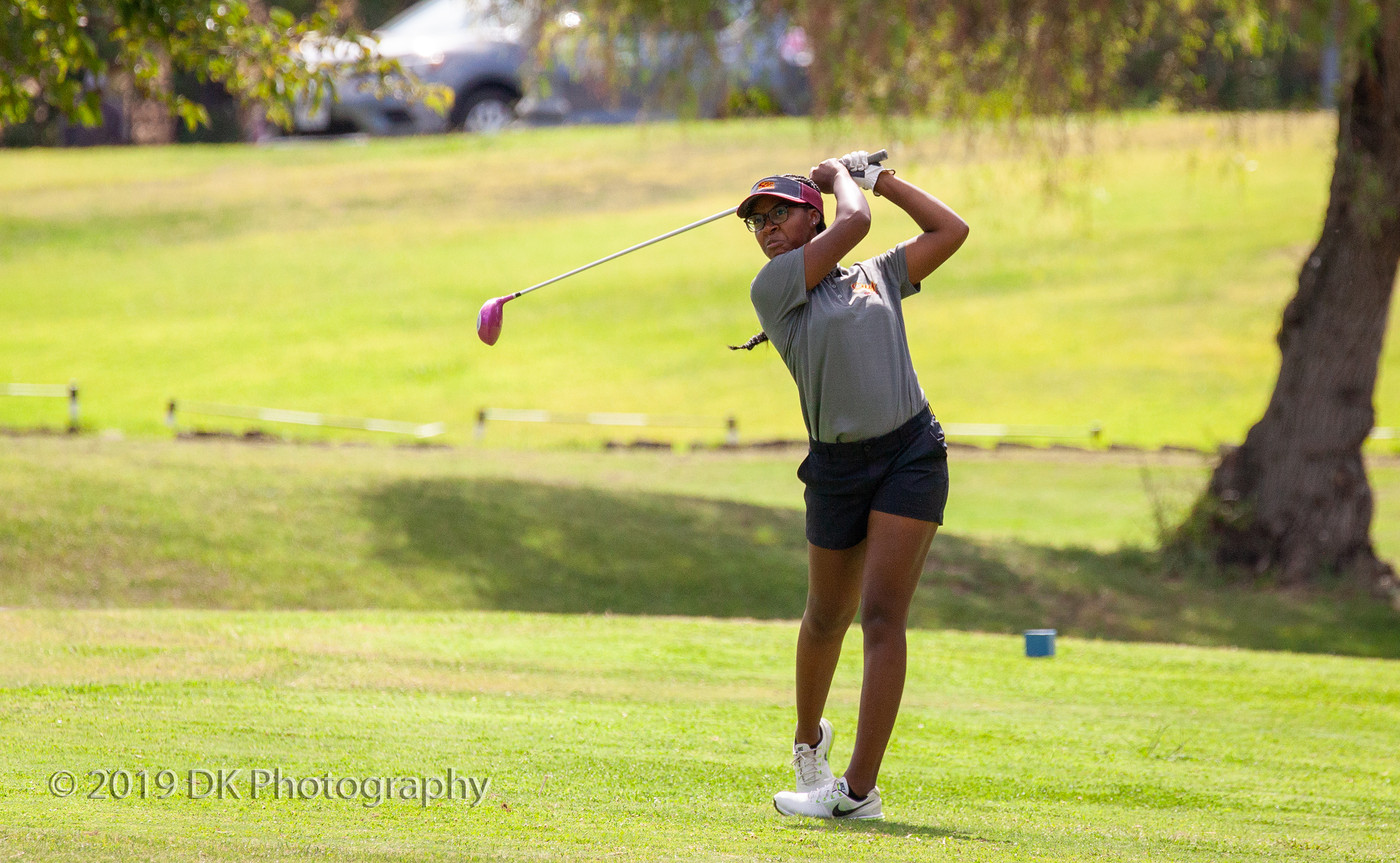 Yunique Williams City College sophomore watches watches her drive on hole #10 at the Big 8 Tournament at Bartley Cavanaugh Golf Course on Sept. 4th.