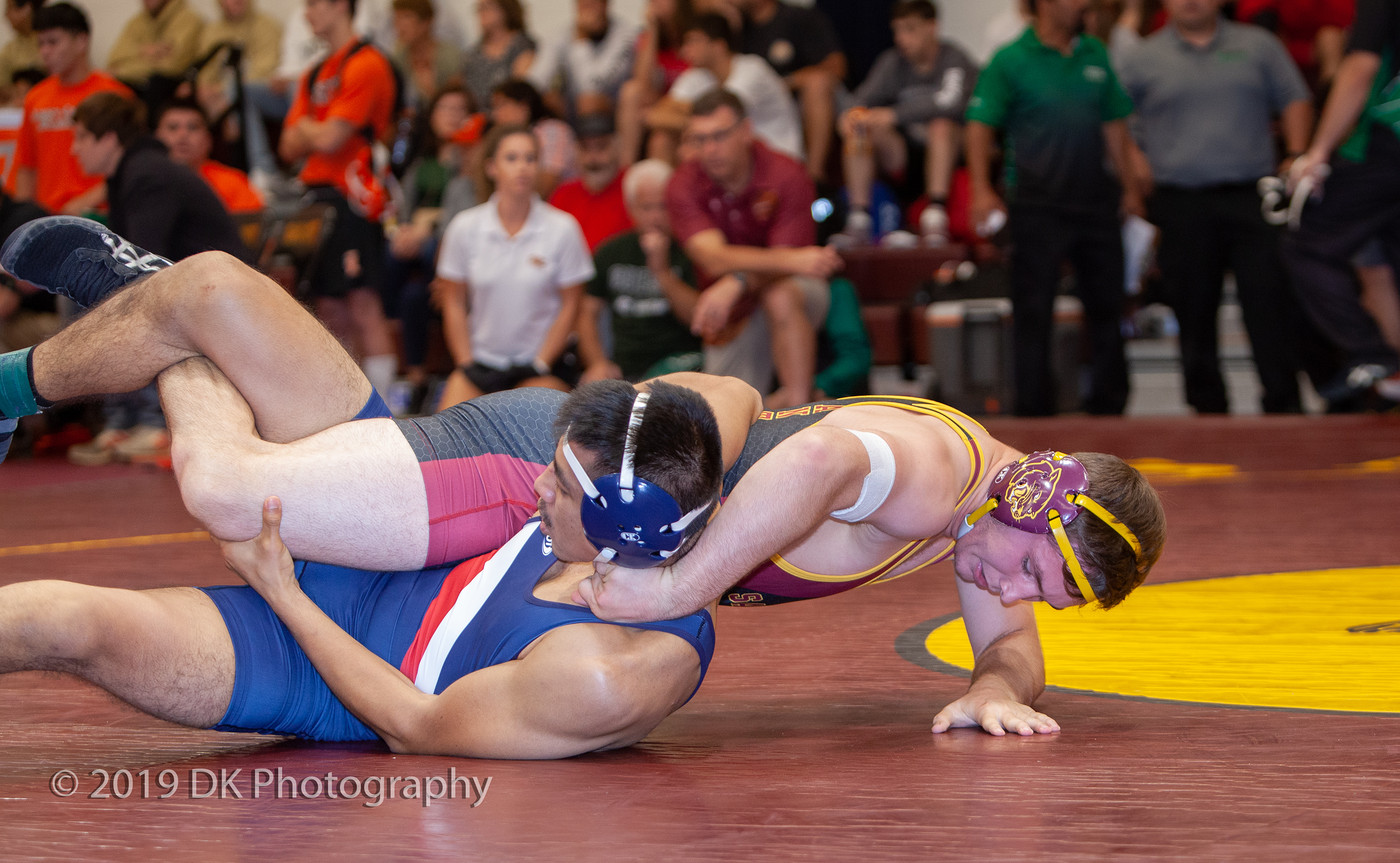 Manny Curry, City College sophomore fights hard in his first  match against Raymond Lopez of Santa Rosa College at the Sac City Invite in the North Gym on Sept. 21st.