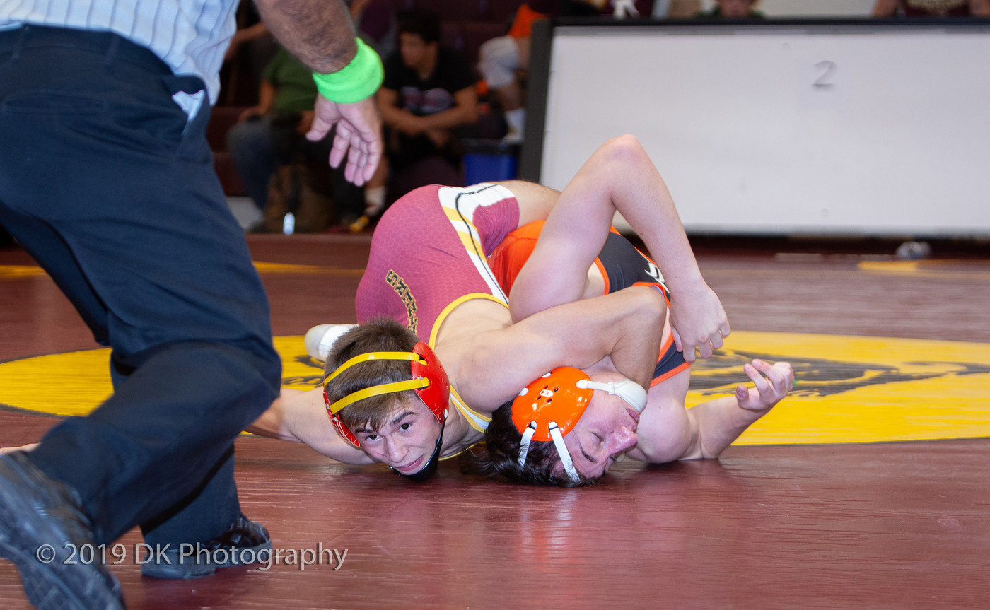 Jacob Hiller, City College freshman fights hard in his first match against Walter Gudiel of Lassen College at the Sac City Invite in the North Gym on Sept. 21st. 