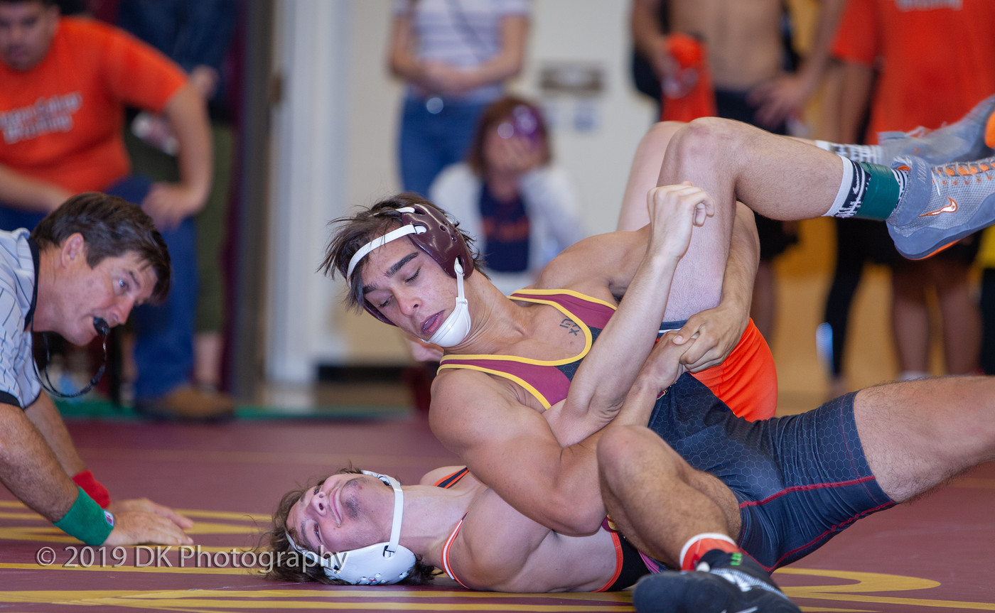 Cole Kachmar, City College freshman fights hard in his match against Logan Blocher of Lassen College at the Sac City Invite in the North Gym on Sept. 21st. 