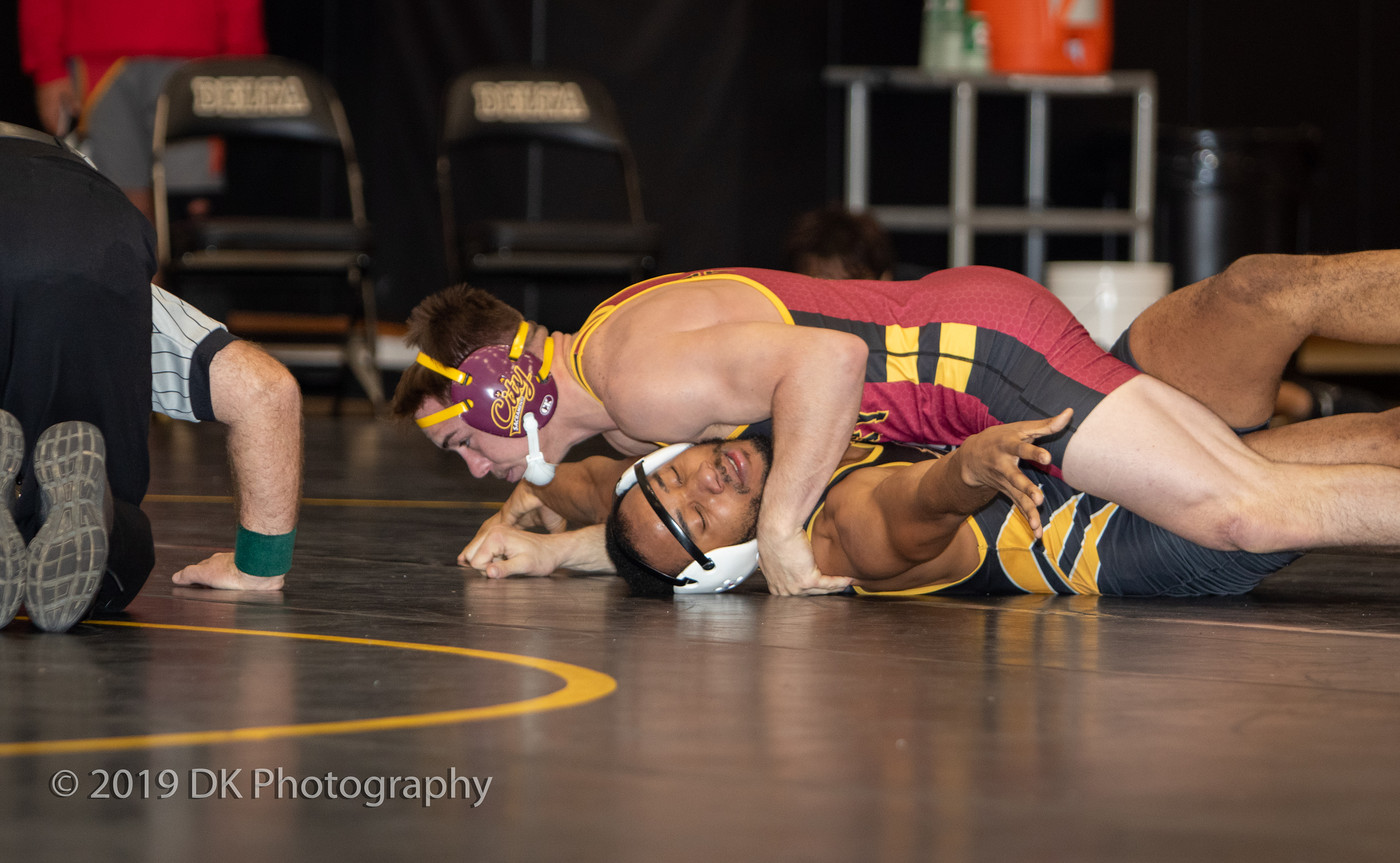 Chase Miles, City College sophomore gets the pin in his match against his opponent from Delta College at Nor Cal Finals at the Blanchard Gym on Dec. 7th.