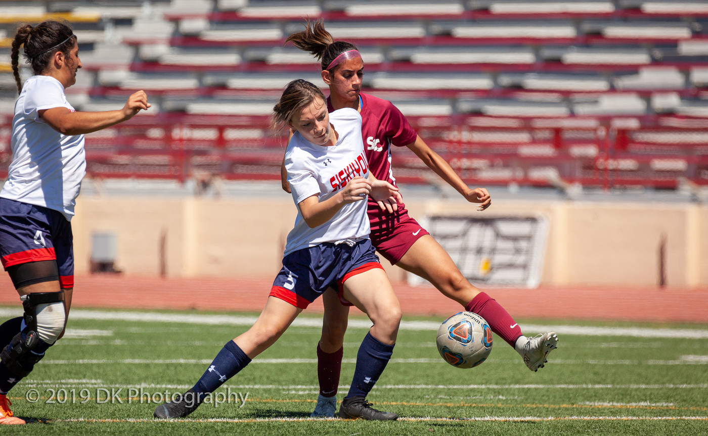 Sohini Sharma (#4), City College freshman puts her leg up to stop the ball against Siskiyous College at Hughes Stadium on Sept. 3rd.