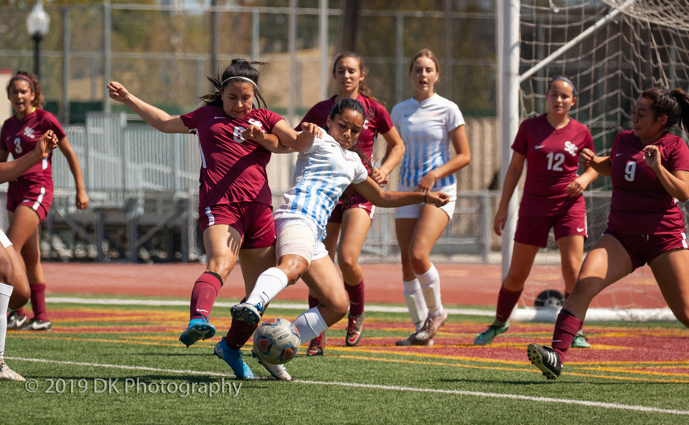 Araceli Sanchez (#6), City College freshman fights for the ball in the match against Sequoias at Hughes Stadium on Sept. 10th.