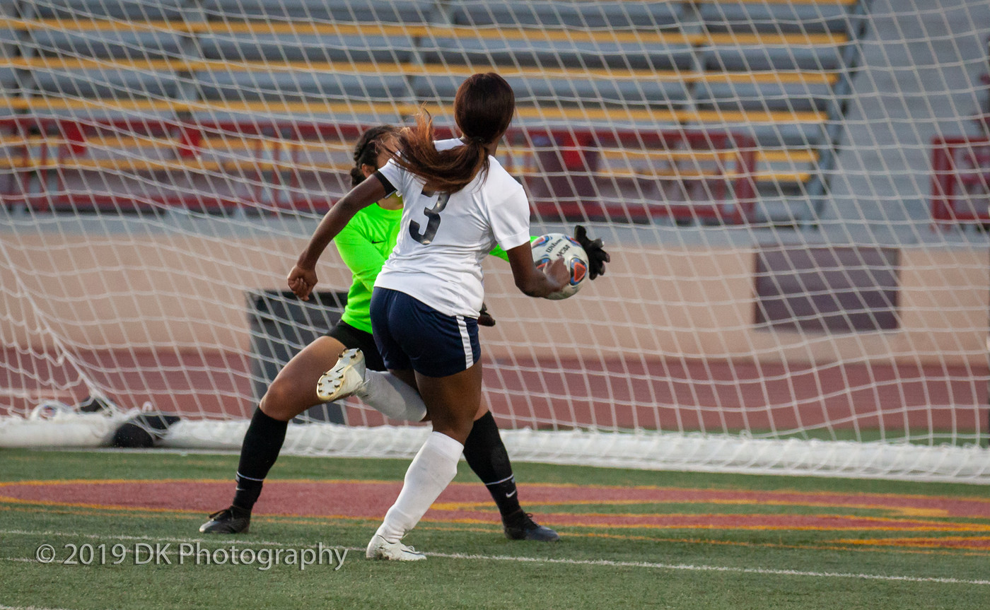 Natalie Rizo (#0), City College  freshman goal keeper just gets her hands on the ball to save the goal in the match against Cosumnes River College at Hughes Stadium on Oct. 3rd. 