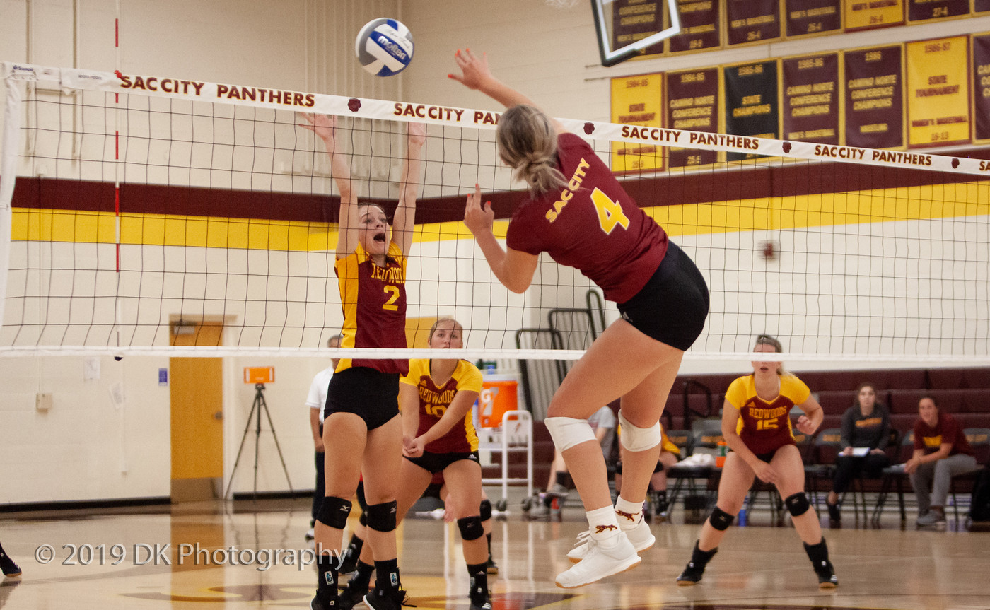 Jessica Baker (#4), City College freshman spikes the ball in the match against Redwoods College in the North Gym on Sept. 4th.