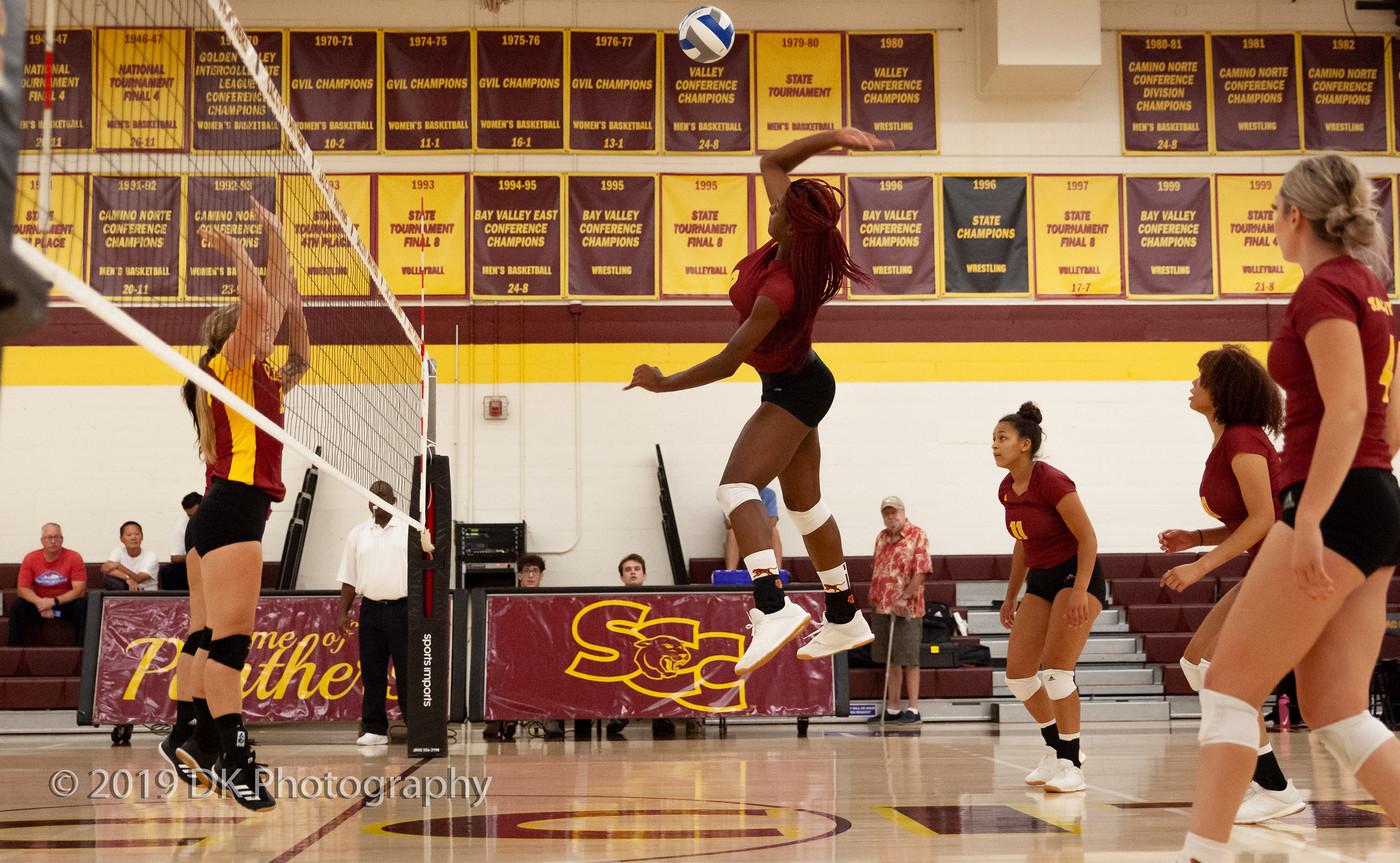 Jaylah Tate (#9), City College sophomore goes up for a spike in the match against Redwoods College in the North Gym on Sept. 4th.