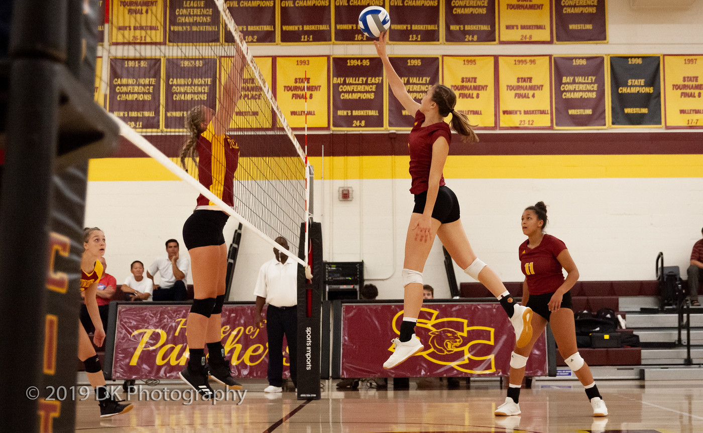 Sierra Reusche (#5), City College freshman tips the ball in the match against Redwoods College in the North Gym on Sept. 4th.