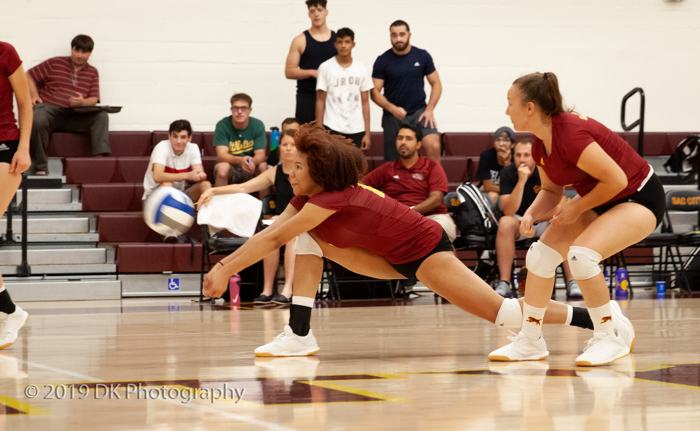 JaShana Bartlett (#10), City College freshman digs the ball in the match against Redwoods College in the North Gym on Sept. 4th