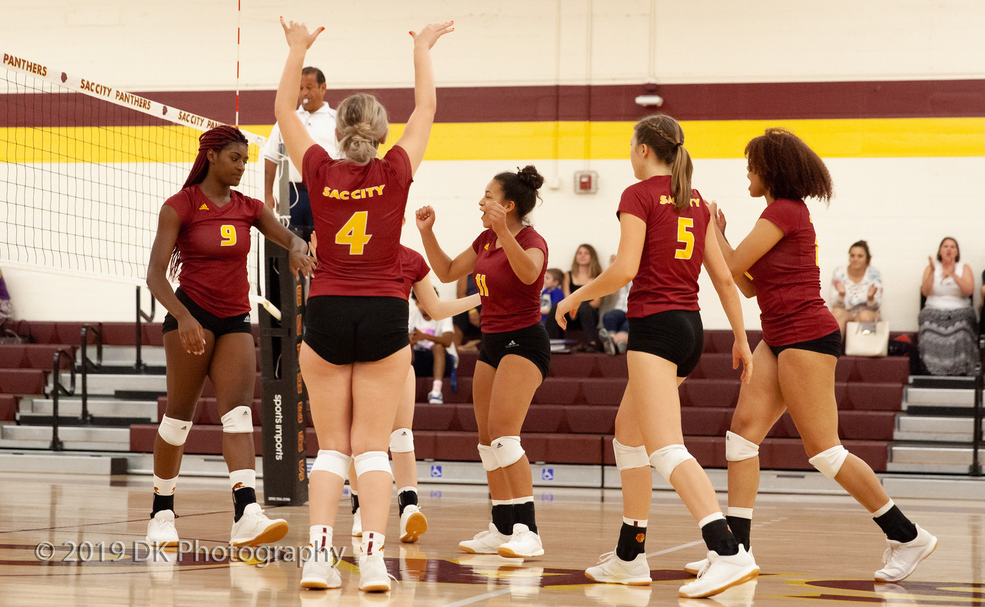 City College volleyball celebrates after a spike by Jaylah Tate (#9) in the match against Redwoods College in the North Gym on Sept. 4th.