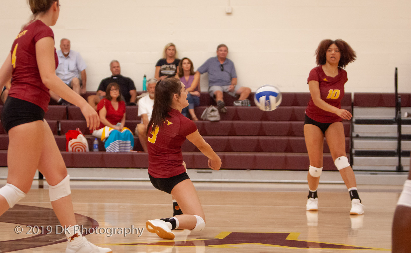 Camrynn Peterson (#3) City College freshman digs the ball in the match against Butte College at the North Gym on Aug. 30th.