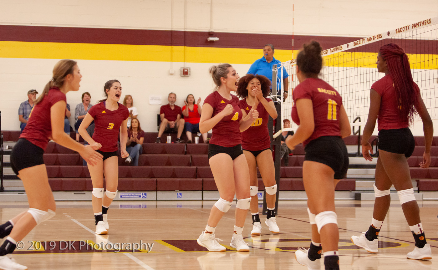 City College reacts after winning the point in the match against Butte College at the North Gym on Aug. 30th. 