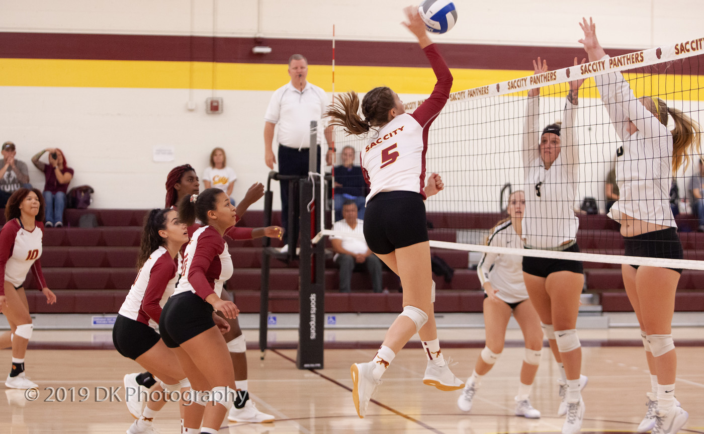 Sierra Reusche (#5), City College freshman goes up for a spike in the match against Delta College at the North Gym on Sept. 27th.