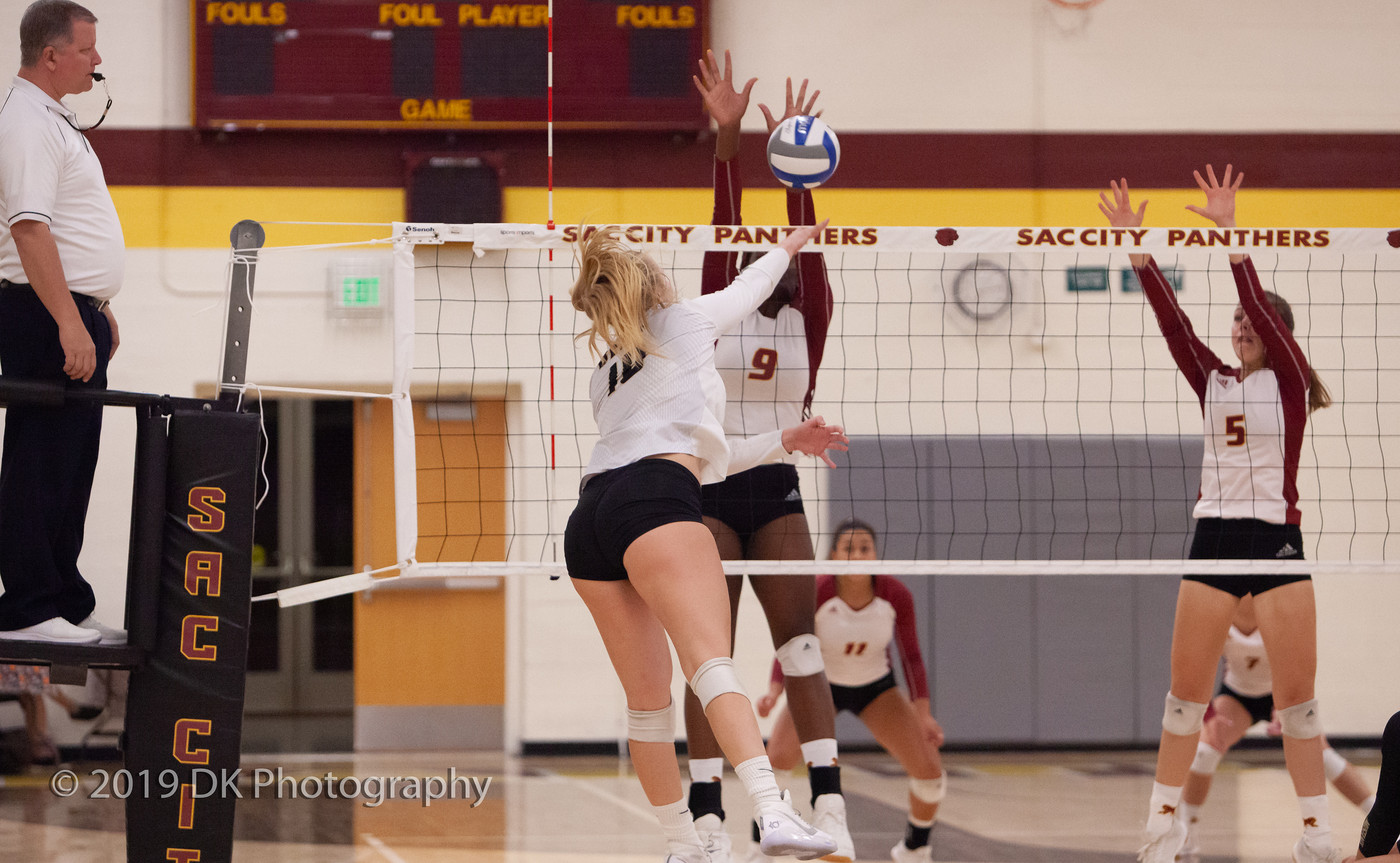 Jaylah Tate (#9), City College sophomore   blocks the spike attempt in the match against Delta College at the North Gym on Sept. 27th.