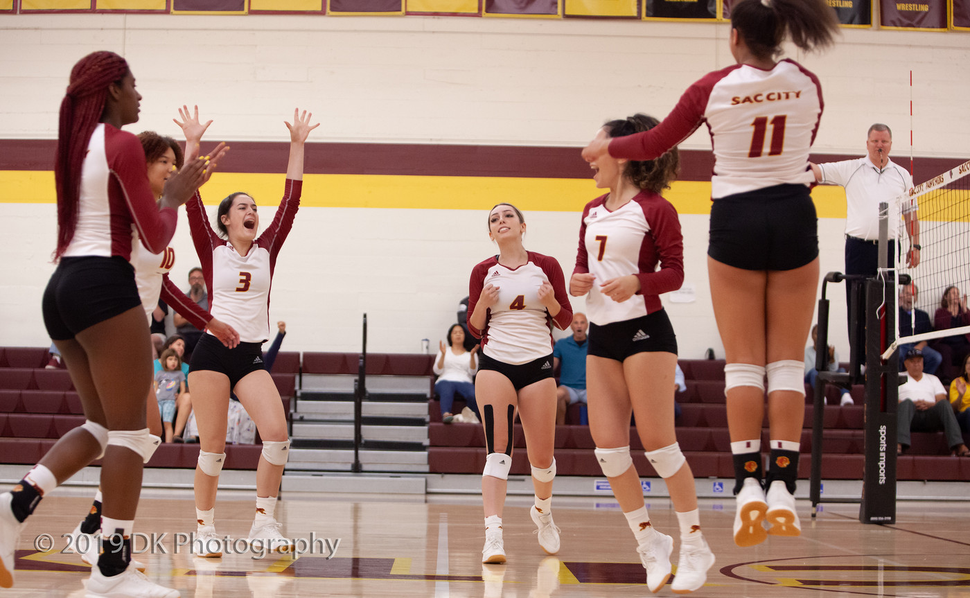 City College reacts after winning the point in the match against Delta College at the North Gym on Sept. 27th.