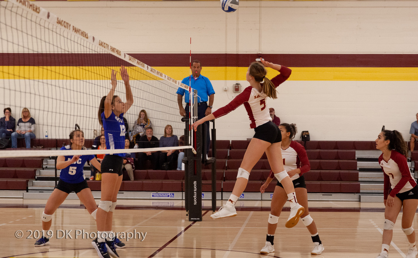 Sierra Reusche (#5), City College freshman goes up for the spike in the match against Modesto Junior College at the North Gym on Oct. 11th.